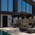 Sunbeds, pool and suite entrance