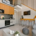 Open plan kitchen and staircase to loft