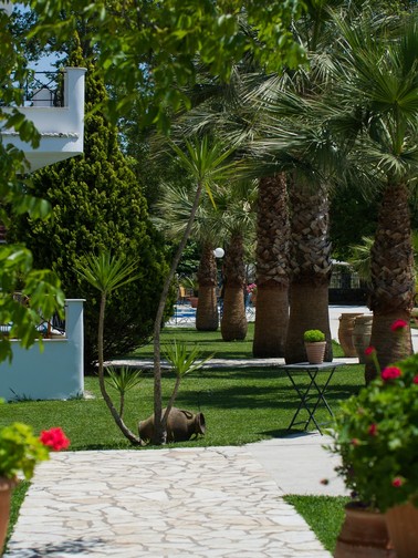 Marble-paved path and palm trees