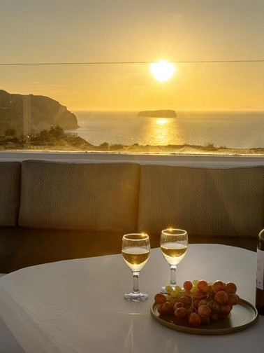 Sunset by the pool with a glass of wine