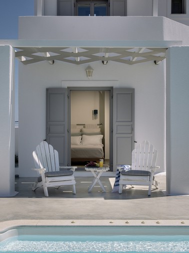 Poolside furniture and access to ground-floor double bedroom