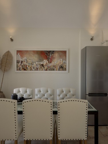 Dining area and kitchen with access to balcony (upper level)
