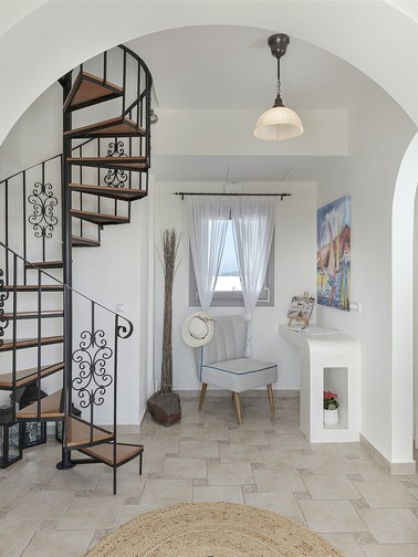 Villa reception room and spiral staircase