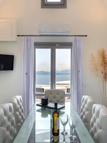 Upper-level dining table and sea-view window