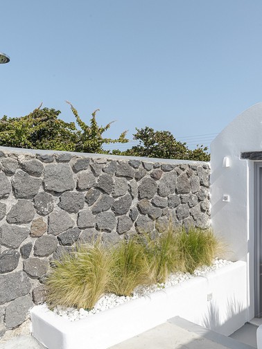 Outdoor shower and poolside bathroom entrance