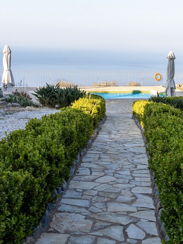 Path leading up to pool overlooking the sea