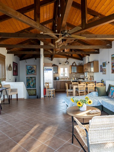 Sitting area, dining table, and kitchen