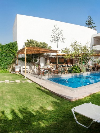 Hotel exterior, pool, and pool bar