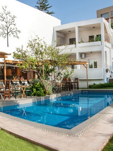 Hotel exterior, pool, and pool bar