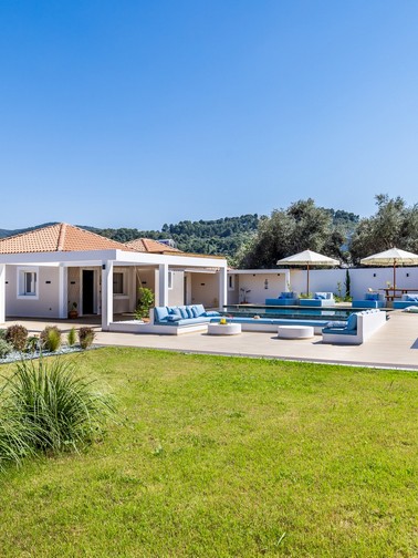 Lawn, garden, and outdoor sitting area and pool