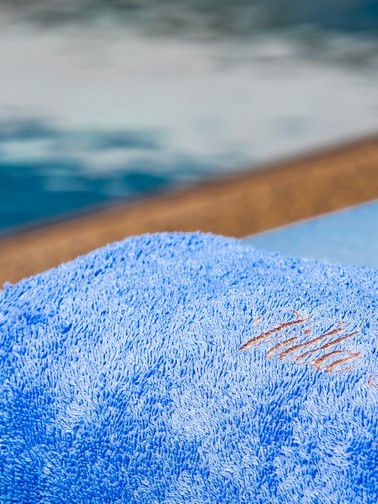 Pool towel with Villa Grace logo