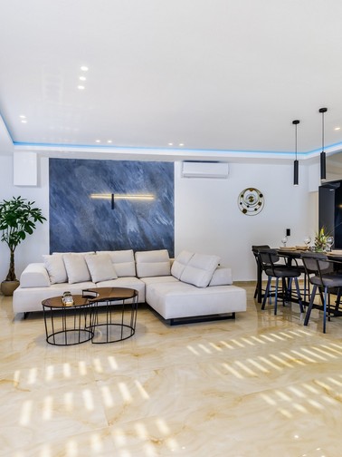 Indoor sitting area, dining table, and open-plan kitchen