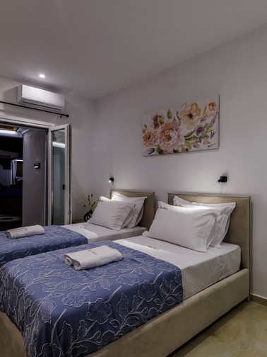 Bedroom with twin beds by night